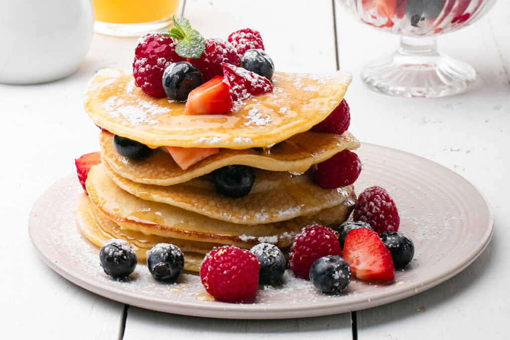 Pancakes with honey and berries